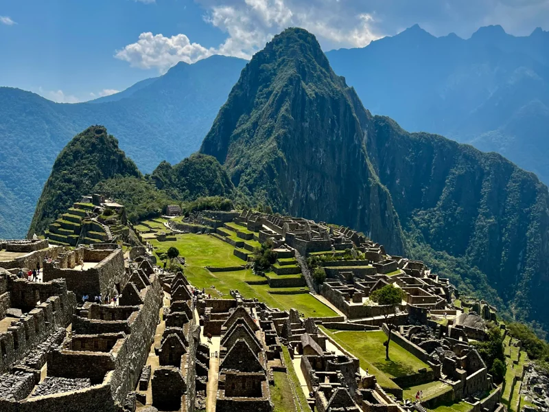 Machu Picchu citadel at sunrise with Huayna Picchu mountain backdrop